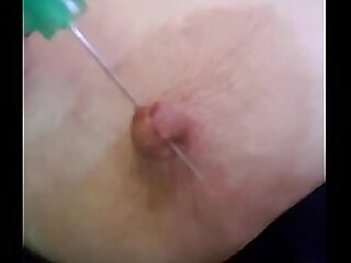 Playing with needles in my nipple
